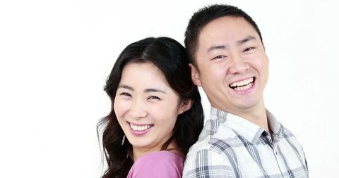 Joyful Asian couple sharing a moment of happiness and togetherness