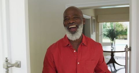 Smiling Older Man Opening Door at Home with Cheerful Expression - Download Free Stock Images Pikwizard.com