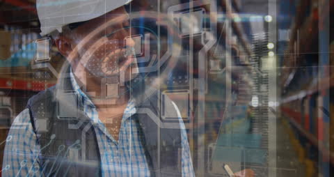 Senior Supervisor Conducting Stock Check in High-Tech Warehouse