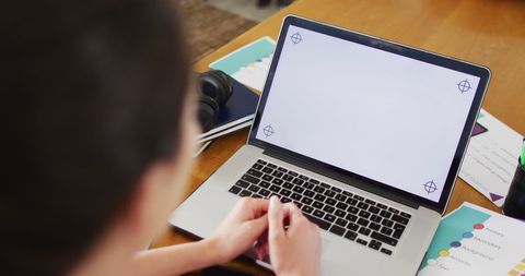 Woman Engaged in Laptop Activity with Blank Screen - Download Free Stock Images Pikwizard.com
