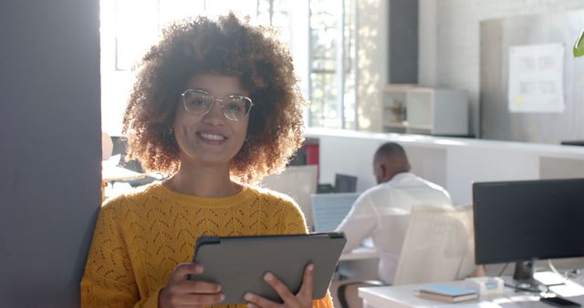 Confident African American Businesswoman Using Tablet in Modern Office Environment - Download Free Stock Images Pikwizard.com