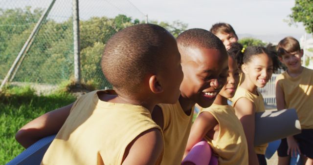 Kids in Yellow Sportswear Laughing and Bonding Outdoors - Download Free Stock Images Pikwizard.com