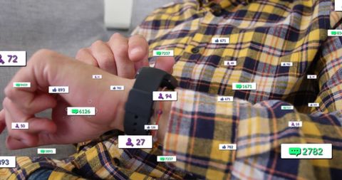 Man checking smartwatch with social media concept overlay