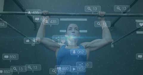 Empowered female athlete at gym with digital overlay