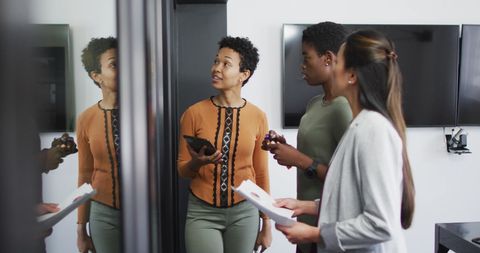 Diverse Team Discussing Business Strategies in Office