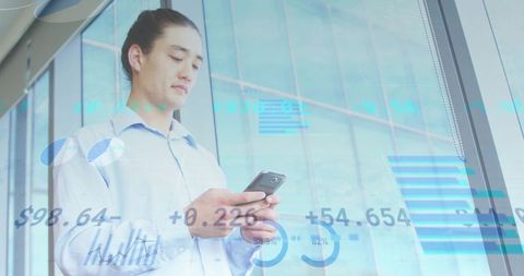 Young Professional Analyzing Financial Charts Smartphone Office