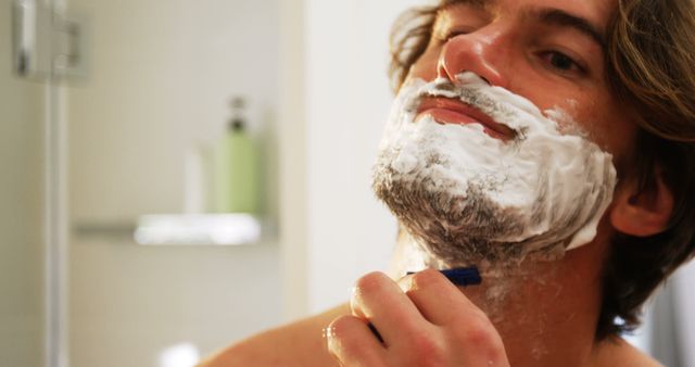 Man Shaving Beard in Bathroom Mirror - Download Free Stock Images Pikwizard.com