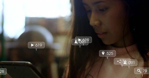 Woman Using Tablet in Cafe with Social Media Metrics Overlay