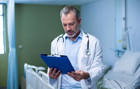 Doctor Analyzing Medical Information with Calm and Concentration