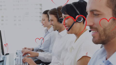 Happy Customer Service Team Working at Call Center Desks