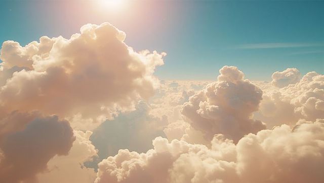 Elegant Cumulus Clouds with Sunlight Glowing Overhead
