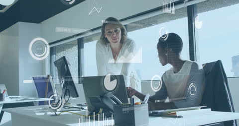 Colleagues Analyzing Data in Modern Office with Interactive Graphics