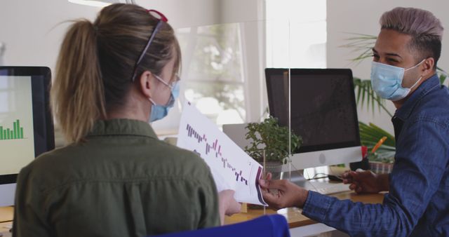 Colleagues Analyzing Business Data While Wearing Face Masks in Office - Download Free Stock Images Pikwizard.com