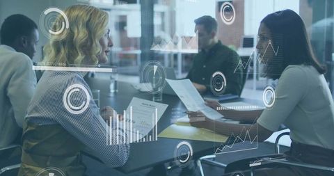 Diverse Business Team Collaborating with Data Visualization in Modern Workspace