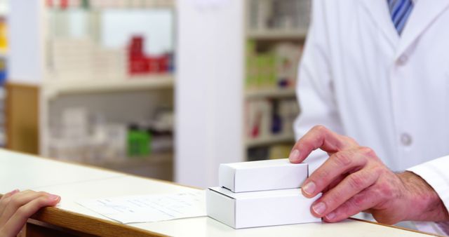 Pharmacist Handing Prescription Boxes to Customer at Pharmacy - Download Free Stock Photos Pikwizard.com