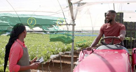 Hydroponic Farming Collaborators Using Technology in Greenhouse