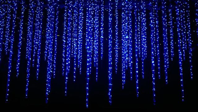Cascading blue led icicle curtain lighting on facade for festive night displays