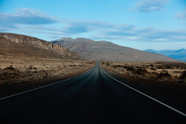 Endless Road through Mountainous Desert Landscape - Download Free Stock Photos Pikwizard.com