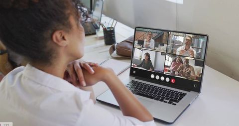Woman joining virtual meeting on laptop at desk, remote teamwork and home office collaboration