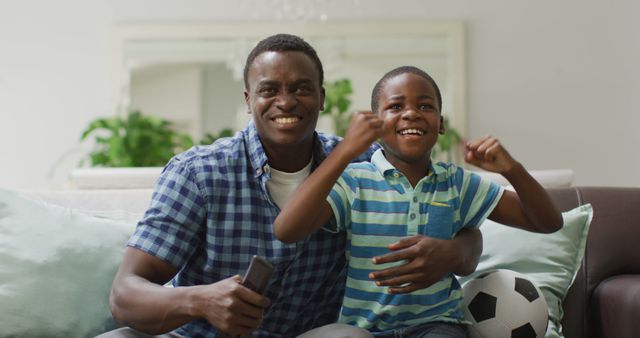 Happy Father and Son Watching Sport Game on TV - Download Free Stock Images Pikwizard.com