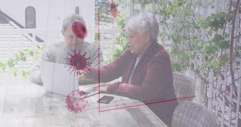 Seniors Reviewing Pandemic Data on Terrace with Digital Overlay