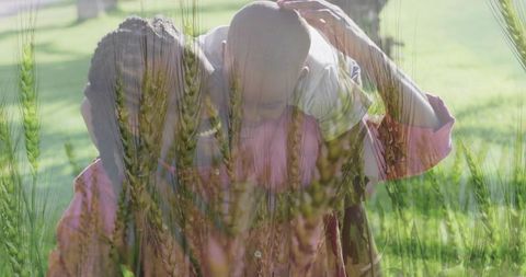 Father Carrying Son Through Wheat Field Embracing Nature