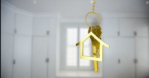 Elegant gold house keychain in luxurious kitchen space