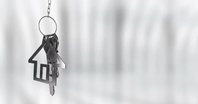 An animated visual featuring house-shaped keychain and keys set against a blurred background. Perfect for themes related to housewarming, real estate, home security, property investment, modern living, and minimalistic design. Ideal for use in presentations, real estate websites, home decor promotional materials, and security system advertisements.