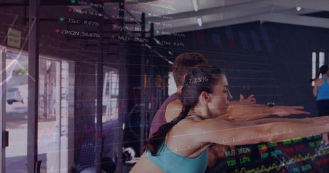 Group exercise class with overlaid stock market data