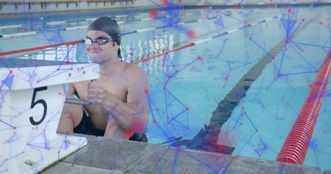 Competitive Swimmer Prepares for Race at Indoor Lap Pool
