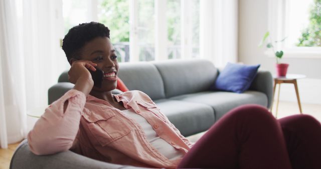 Woman Relaxing on Sofa While Talking on Smartphone - Download Free Stock Images Pikwizard.com