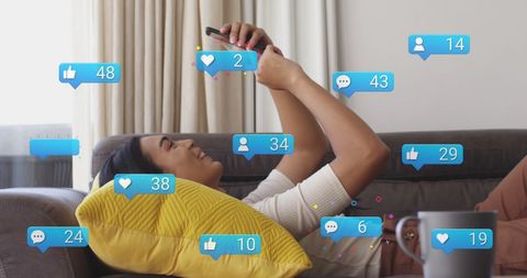 Young woman engaged with social media on smartphone at home