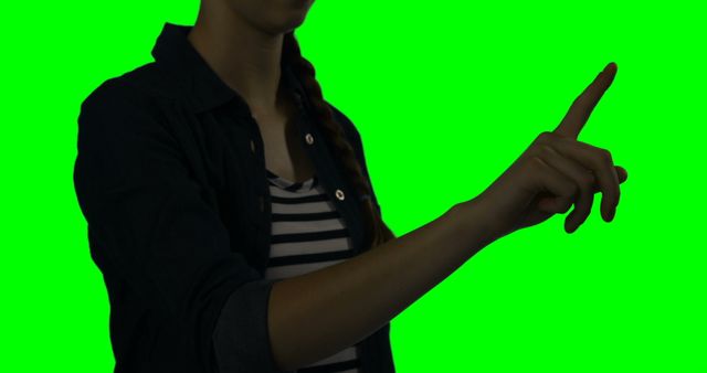 Mid section of woman using digital screen against green screen  - Download Free Stock Photos Pikwizard.com