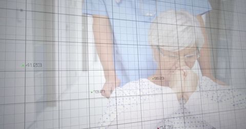 Senior patient with healthcare worker and analytic overlay