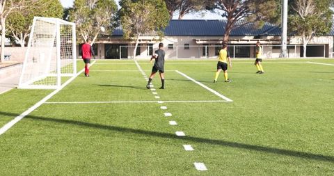 Soccer Players Preparing for Game on Sunny Day