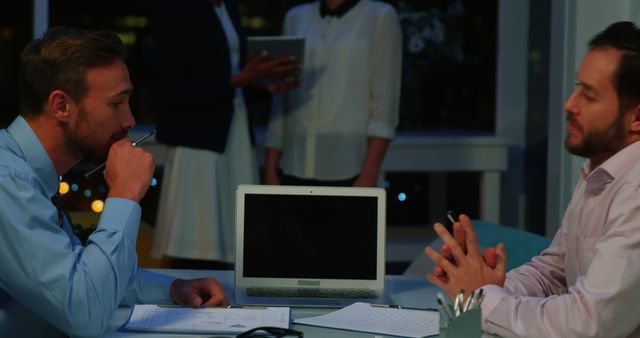 Businessmen Discussing Project Late at Night in Office - Download Free Stock Images Pikwizard.com