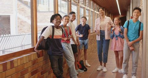 Students Engaging with Teacher in Bright School Hallway - Download Free Stock Images Pikwizard.com