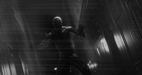 Mysterious figure in dark corridor evoking fear and suspense