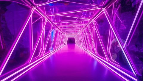 Neon Geometric Tunnel Leading Forward with Pink LED Triangular Frames and Reflections