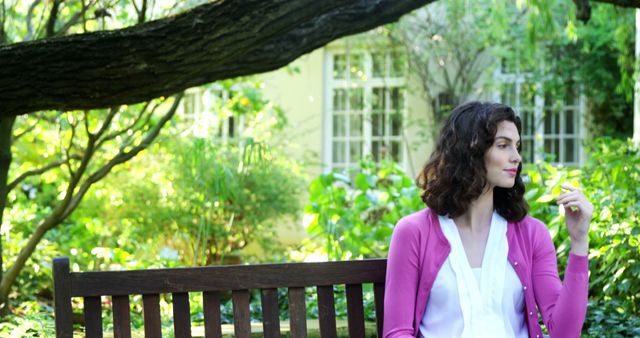 Thoughtful Woman Sitting on Bench in Serene Garden - Download Free Stock Images Pikwizard.com