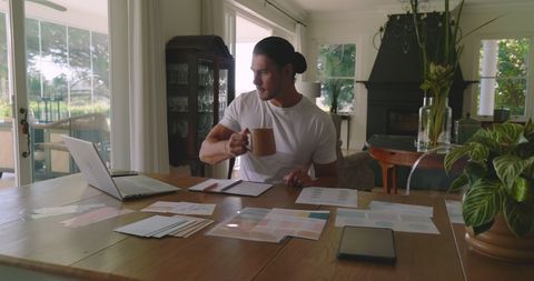 Man Strategizing Virtual Tasks in Home Office Ambiance