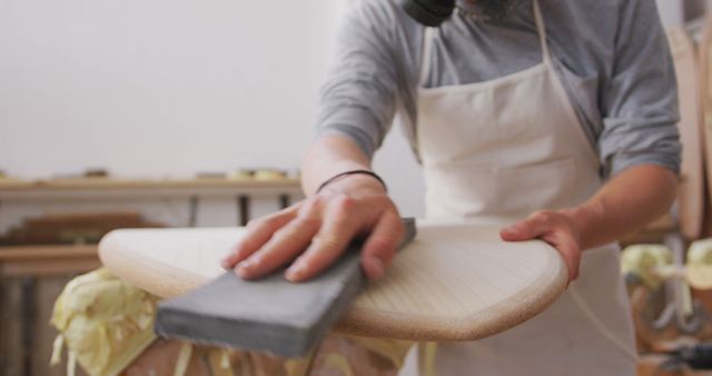 Craftsman Shaping Wood with Sandpaper in Workshop - Download Free Stock Images Pikwizard.com