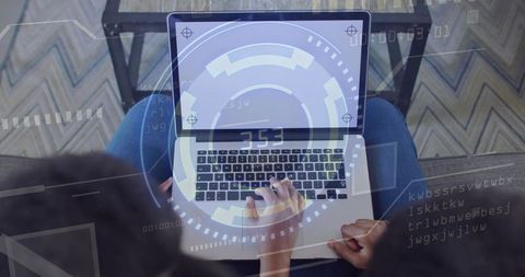 Working mother and teenage daughter collaborating on laptop with augmented reality hud