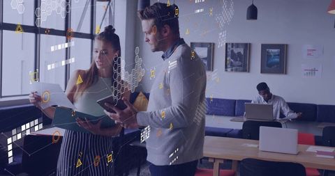 Teamwork collaboration with digital overlays in stylish office