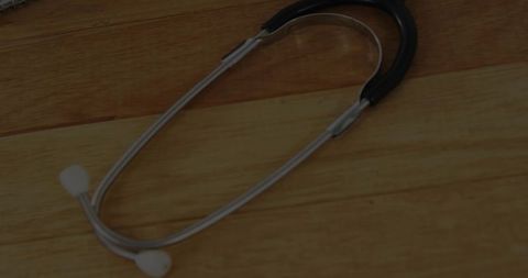 Stethoscope on Wooden Desk in Medical Environment