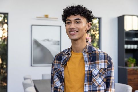 Confident Young Adult in Stylish Dining Area