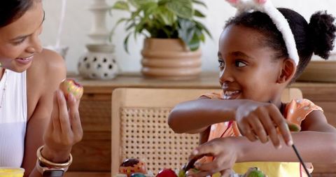 Mother and Daughter Painting Easter Eggs, Creative Bonding Time