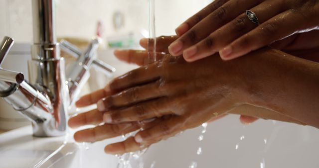 Close-up of Hands Washing Under Running Water in the Sink - Download Free Stock Images Pikwizard.com