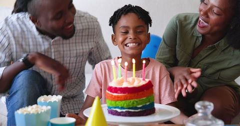 Joyful Family Celebrating Birthday with Colorful Cake