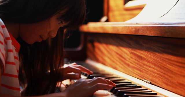 Focused Child Practicing Piano Showing Determination and Passion - Download Free Stock Images Pikwizard.com